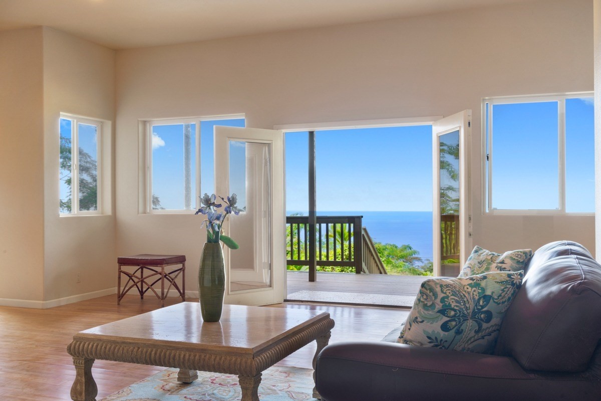 87-410 Kaohe Mauka Road Captain Cook, HI 96704 - Photo 1 of 29 a living room with furniture and a table