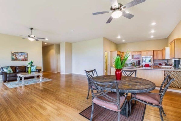87-410 Kaohe Mauka Road Captain Cook, HI 96704 - Photo 14 of 29 a view of a dining room with furniture and wooden floor