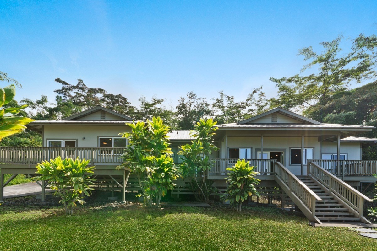 87-410 Kaohe Mauka Road Captain Cook, HI 96704 - Photo 4 of 29 a front view of a house with a yard