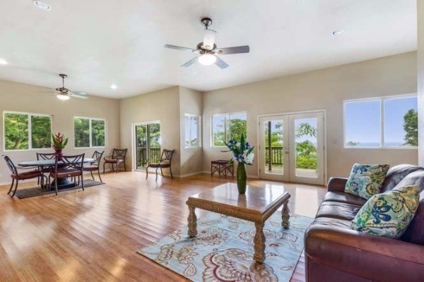 87-410 Kaohe Mauka Road Captain Cook, HI 96704 - Photo 8 of 29 a living room with furniture and a large window