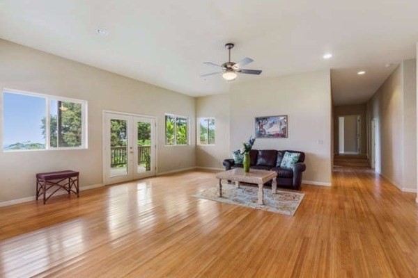 87-410 Kaohe Mauka Road Captain Cook, HI 96704 - Photo 10 of 29 a living room with furniture and wooden floor