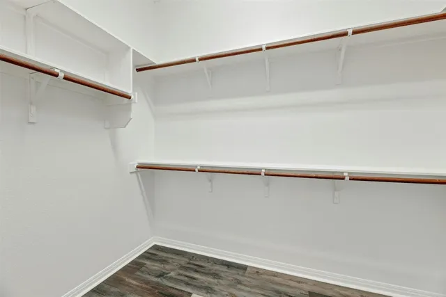 a view of an empty walk in closet