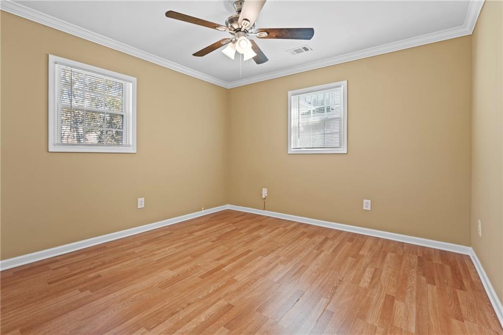 159 Walnut Street Northwest Atlanta, GA 30314 - Photo 11 of 19 a view of an empty room with wooden floor