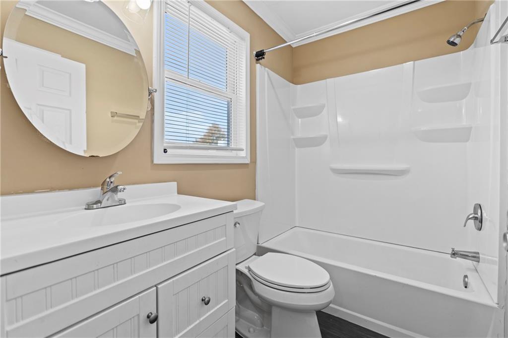 159 Walnut Street Northwest Atlanta, GA 30314 - Photo 13 of 19 a bathroom with a sink a toilet and shower