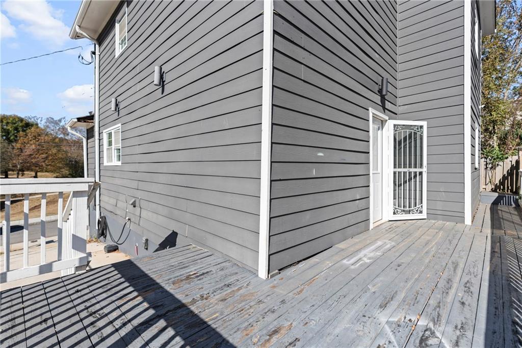 159 Walnut Street Northwest Atlanta, GA 30314 - Photo 17 of 19 a view of a balcony with wooden floor and fence