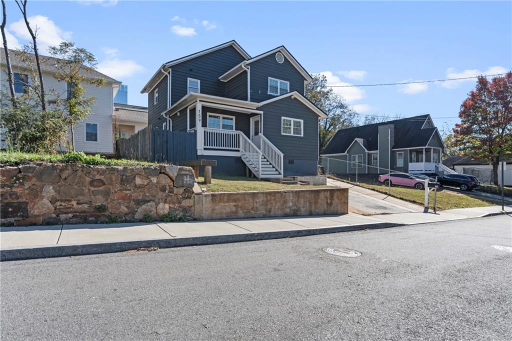 159 Walnut Street Northwest Atlanta, GA 30314 - Photo 2 of 19 a view of a house with a swimming pool