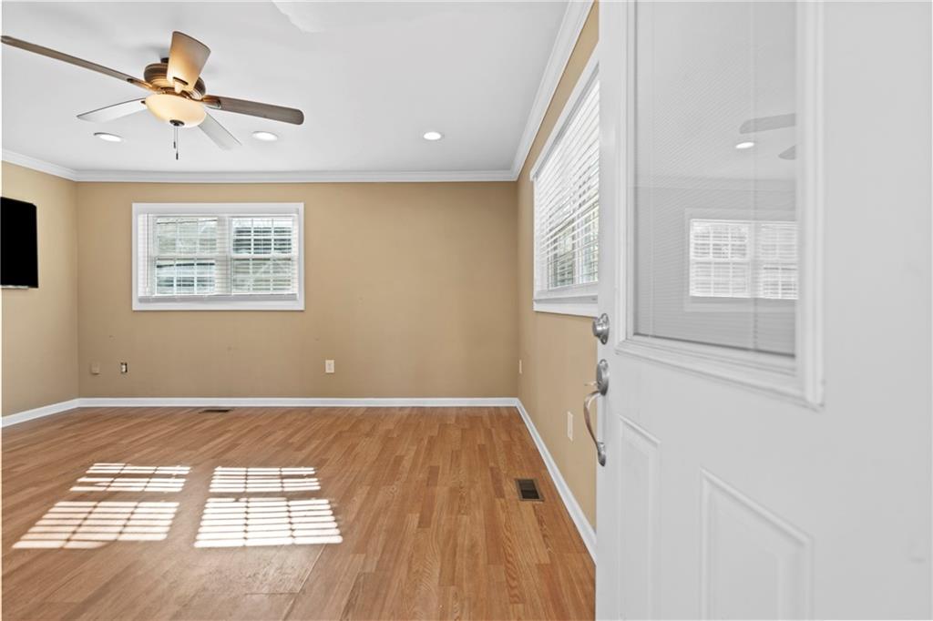 159 Walnut Street Northwest Atlanta, GA 30314 - Photo 4 of 19 wooden floor in an empty room with a window