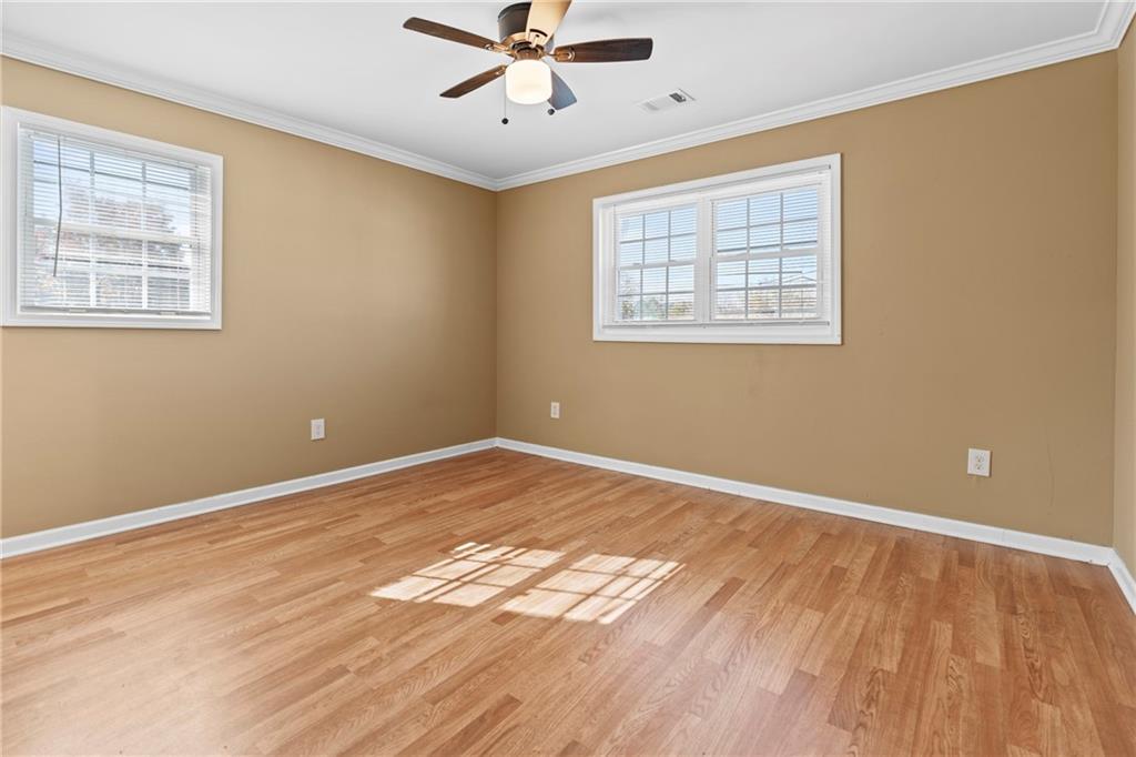 159 Walnut Street Northwest Atlanta, GA 30314 - Photo 9 of 19 a view of an empty room with wooden floor and a window