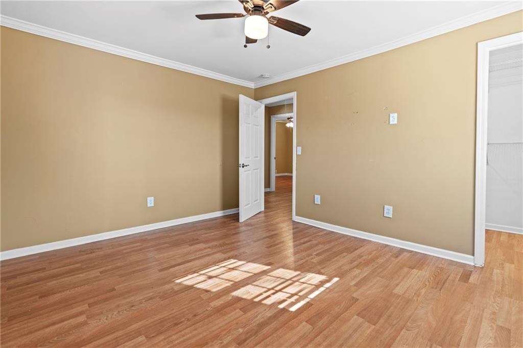159 Walnut Street Northwest Atlanta, GA 30314 - Photo 10 of 19 wooden floor in an empty room with a window