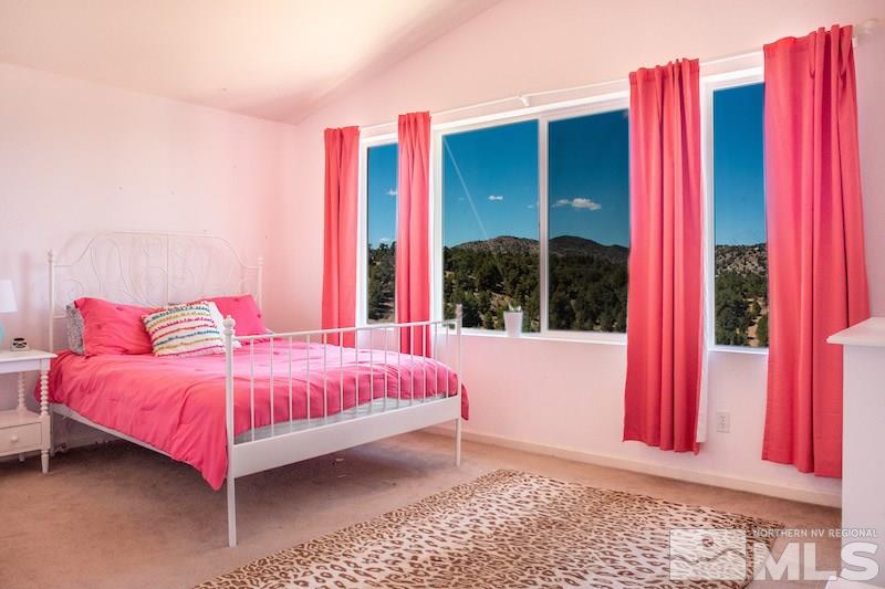 2071 Empire Road Reno, NV 89521 - Photo 12 of 25 a bedroom with a bed and a window