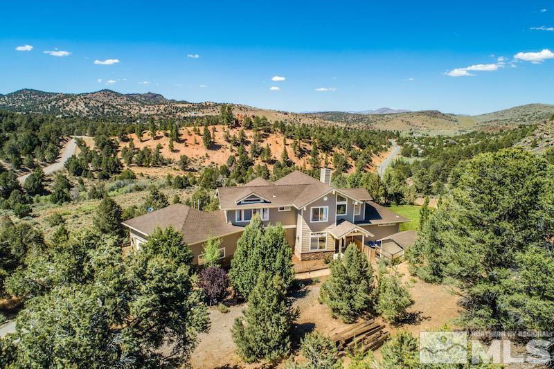 2071 Empire Road Reno, NV 89521 - Photo 22 of 25 an aerial view of residential houses with outdoor space and trees