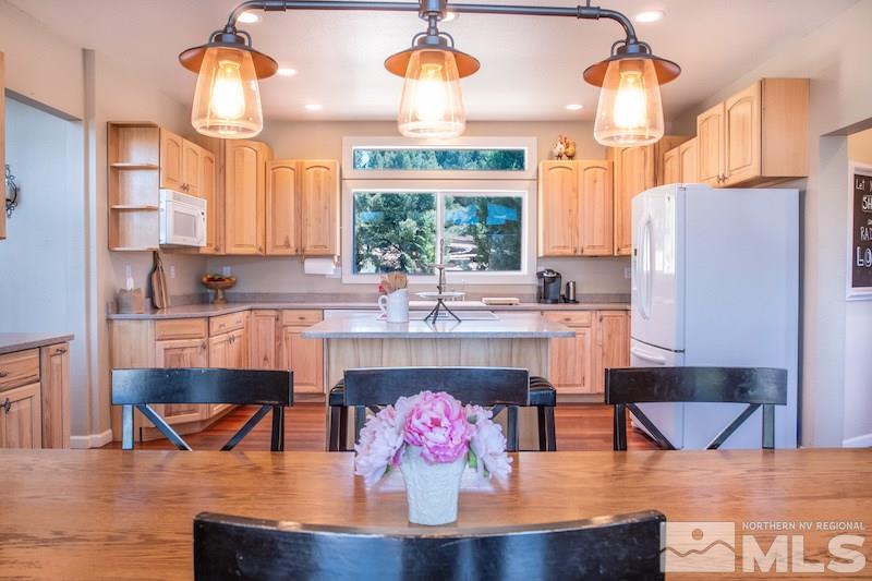 2071 Empire Road Reno, NV 89521 - Photo 25 of 25 a living room with stainless steel appliances kitchen island granite countertop furniture and a fireplace