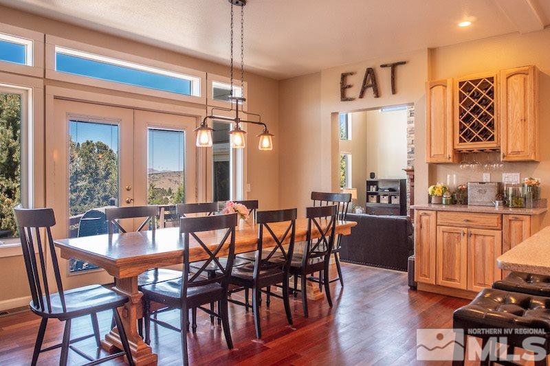 2071 Empire Road Reno, NV 89521 - Photo 5 of 25 a view of a dining room with furniture and wooden floor