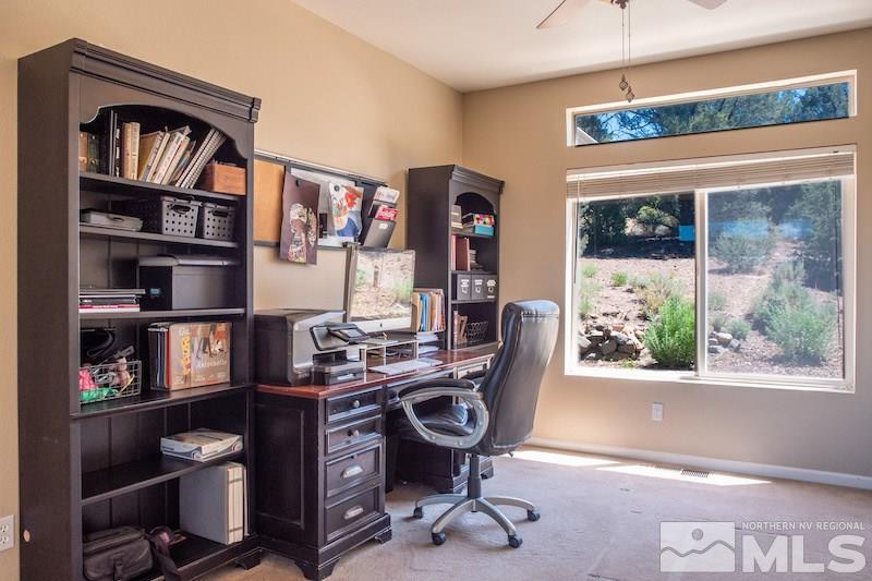 2071 Empire Road Reno, NV 89521 - Photo 7 of 25 a view of a workspace with furniture and a window
