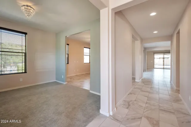 a view of livingroom with an empty space and window