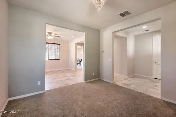 an empty room with closet and a bathroom