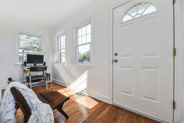 a view of a livingroom with furniture and a window