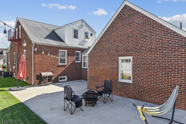 a patio with a table and chairs