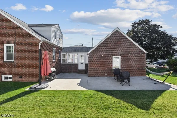 a house view with a sitting space and garden space