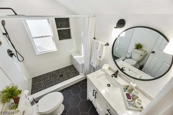 a bathroom with a sink and mirror