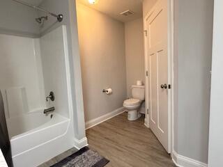 8544 Laredo Street Navarre, FL 32566 - Photo 22 of 36 a bathroom with a bathtub toilet and a shower