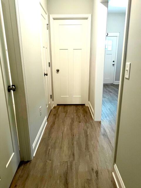 8544 Laredo Street Navarre, FL 32566 - Photo 23 of 36 a view of a room with wooden floor and a small space