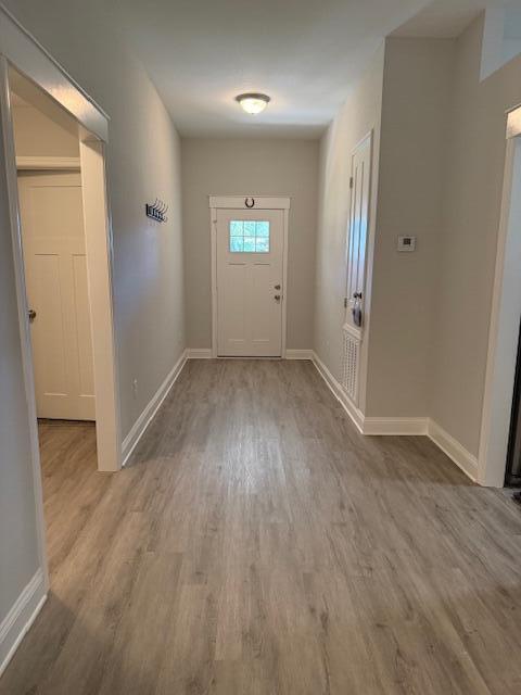 8544 Laredo Street Navarre, FL 32566 - Photo 4 of 36 an empty room with wooden floor and windows