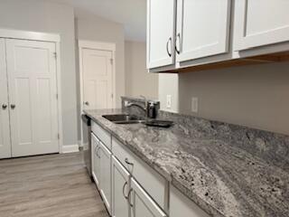 8544 Laredo Street Navarre, FL 32566 - Photo 5 of 36 a kitchen with a sink and cabinets