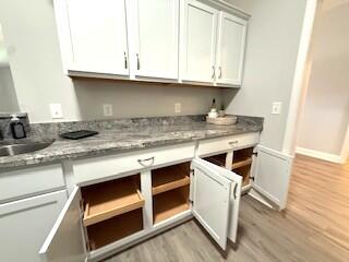8544 Laredo Street Navarre, FL 32566 - Photo 9 of 36 a kitchen with granite countertop a stove and a sink