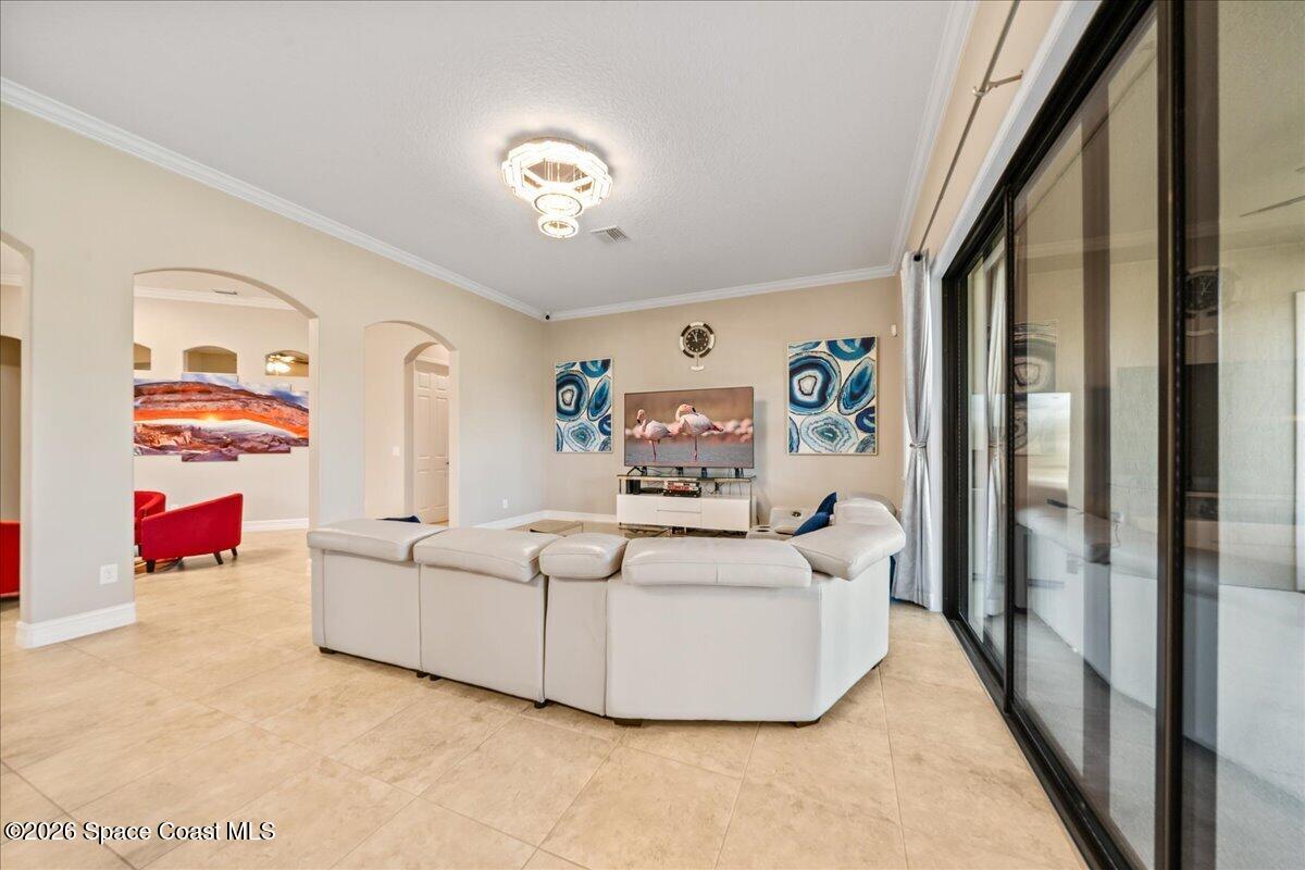 2906 Balting Place Melbourne, FL 32940 - Photo 15 of 44 a living room with furniture and a flat screen tv
