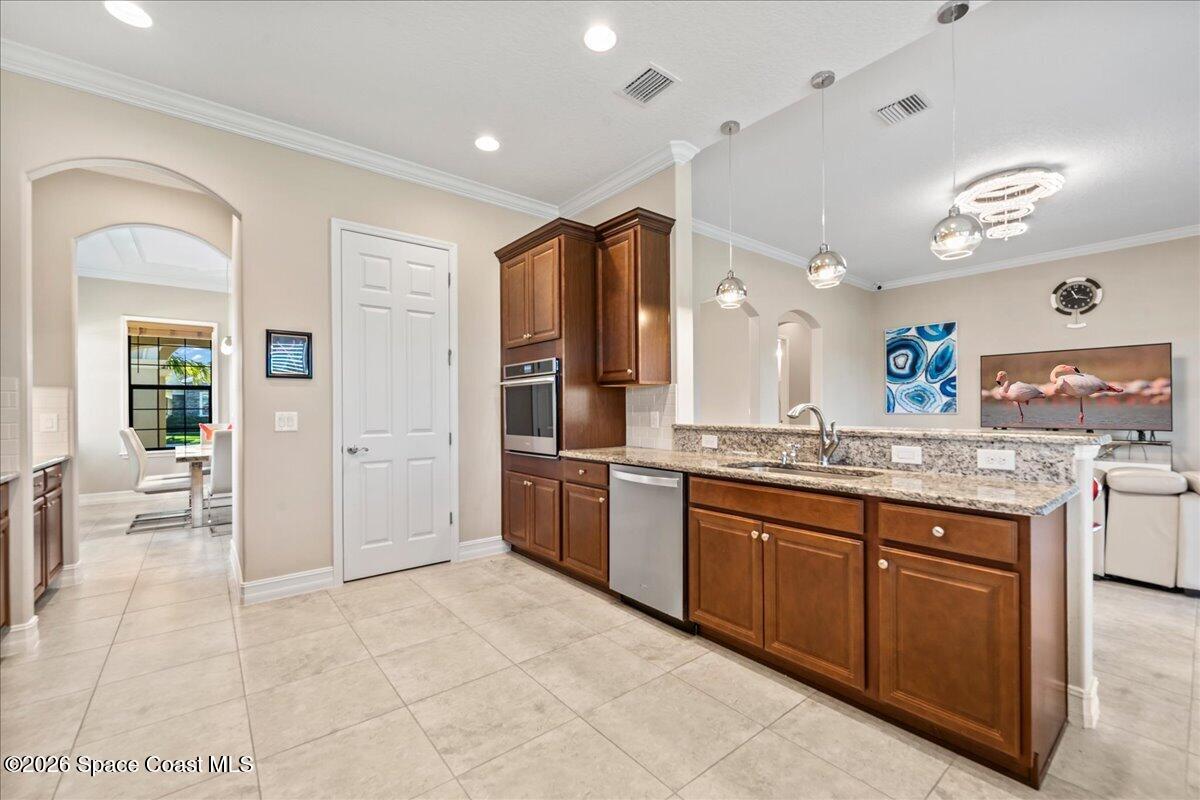 2906 Balting Place Melbourne, FL 32940 - Photo 18 of 44 a large bathroom with a granite countertop double vanity sink a mirror and a bathtub