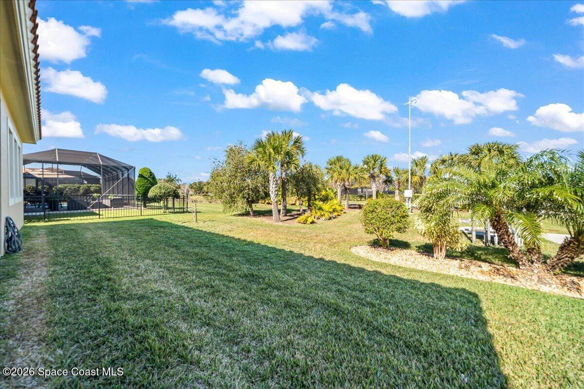 2906 Balting Place Melbourne, FL 32940 - Photo 37 of 44 a view of yard with swimming pool