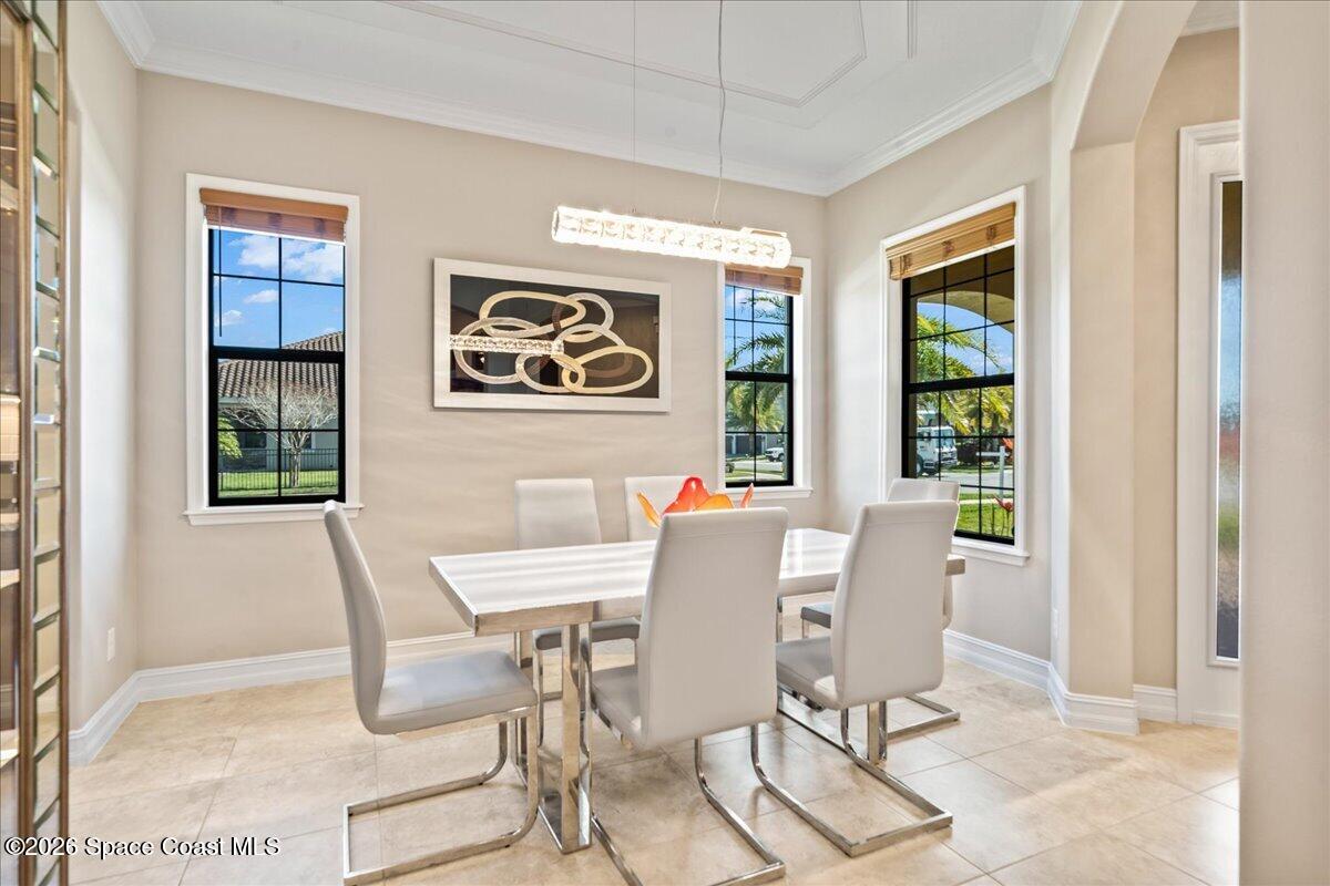 2906 Balting Place Melbourne, FL 32940 - Photo 9 of 44 a view of a dining room with furniture and window