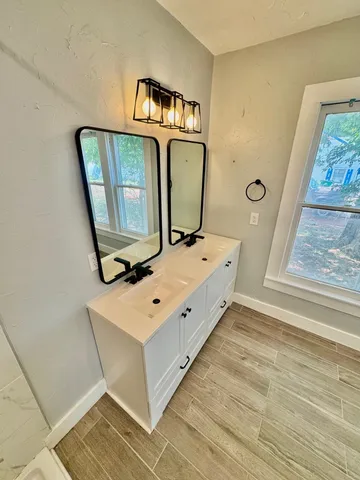 a view of front door with wooden floor