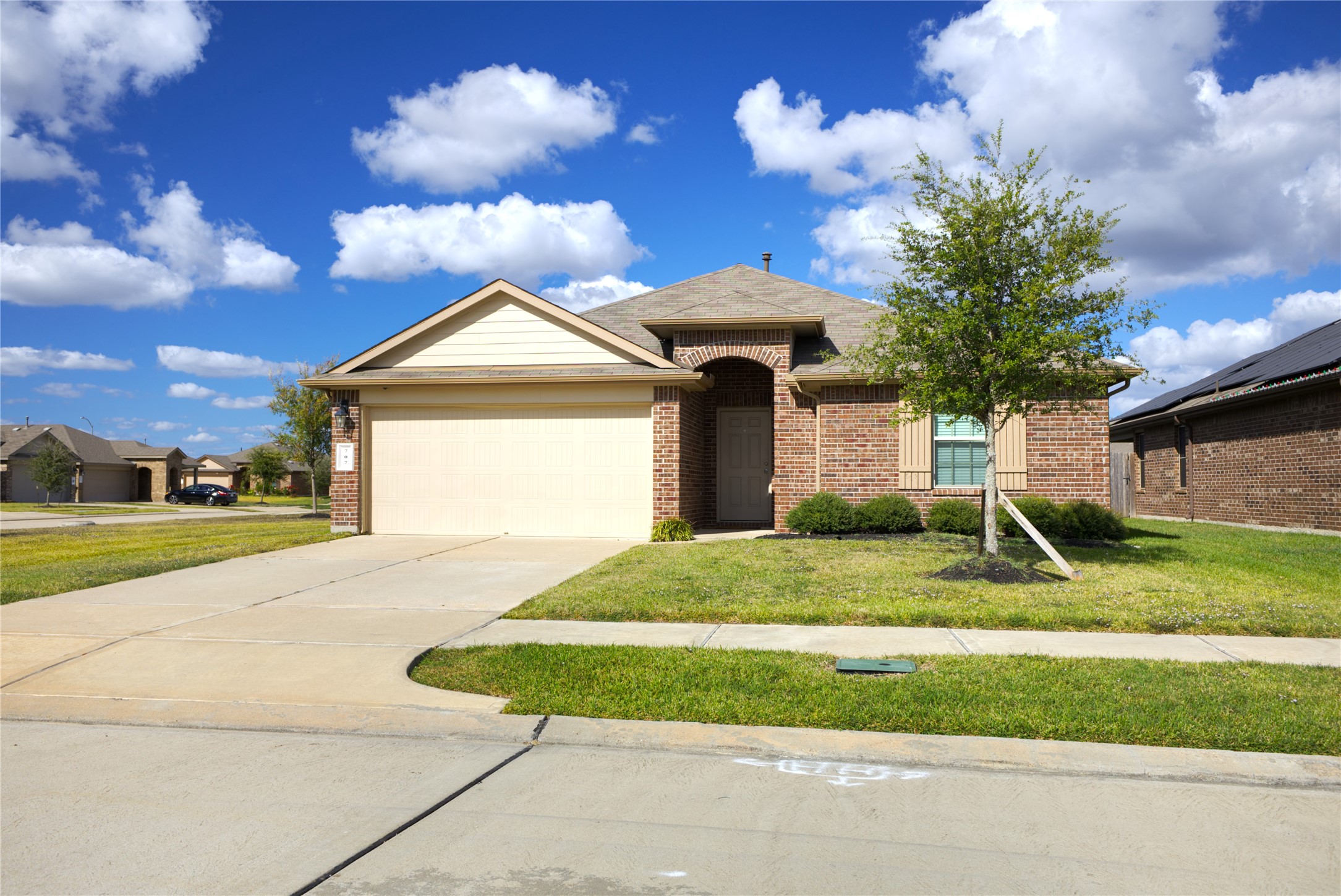 a front view of a house with garden