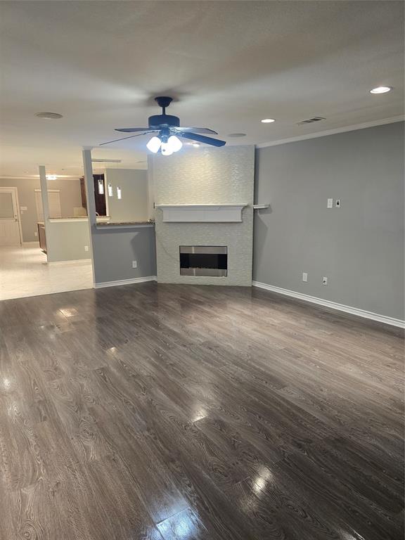 700 White Fields Way Arlington, TX 76002 - Photo 11 of 31 a view of a livingroom with a fireplace a chandelier and wooden floor