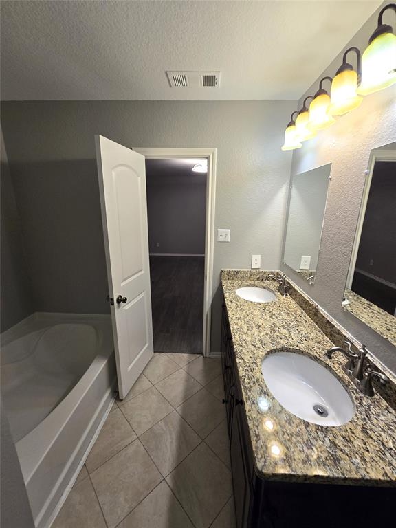 700 White Fields Way Arlington, TX 76002 - Photo 22 of 31 a bathroom with a sink and mirror