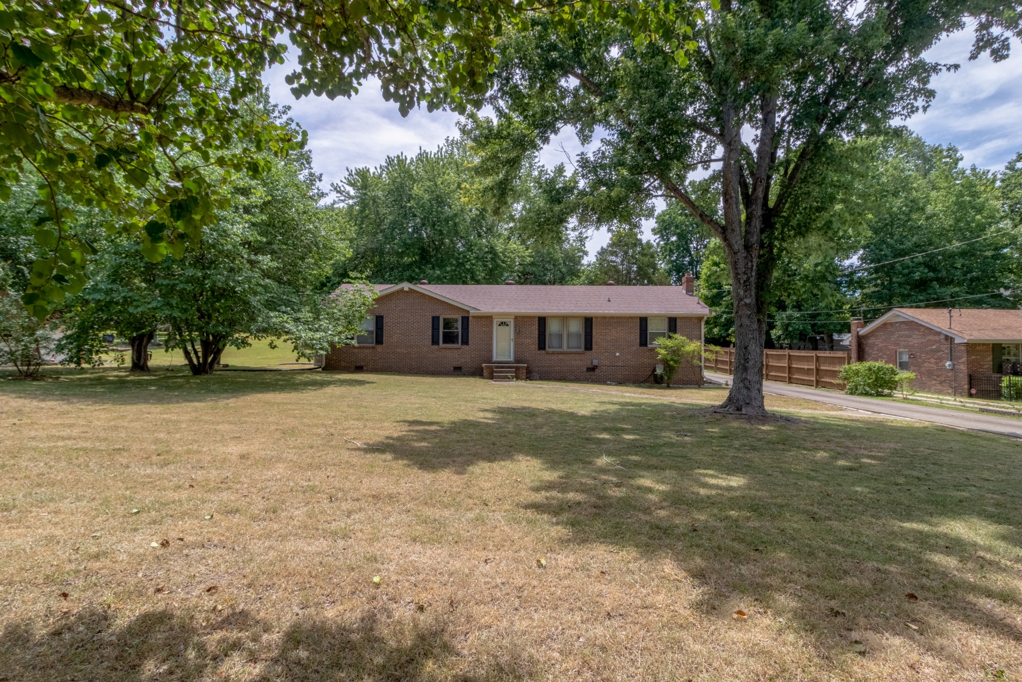 571 Bryan Road Clarksville, TN 37043 - Photo 1 of 7 a front view of a house with a yard and trees