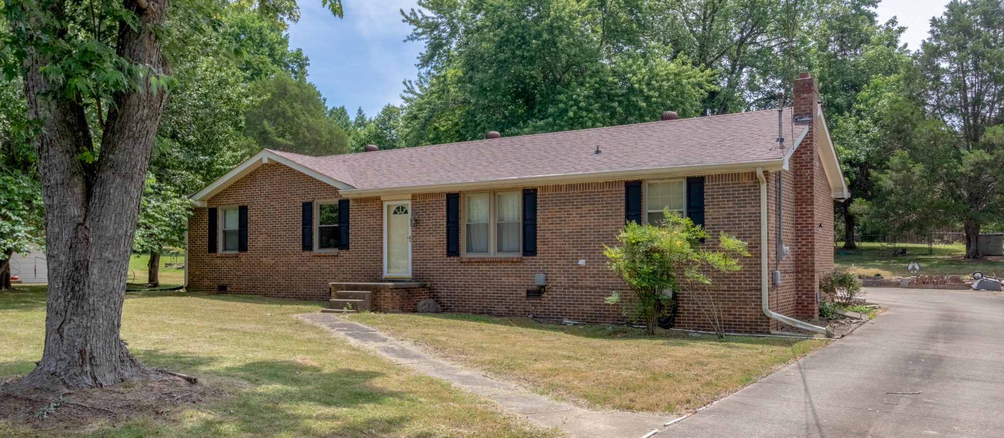 571 Bryan Road Clarksville, TN 37043 - Photo 3 of 7 a house with trees in the background