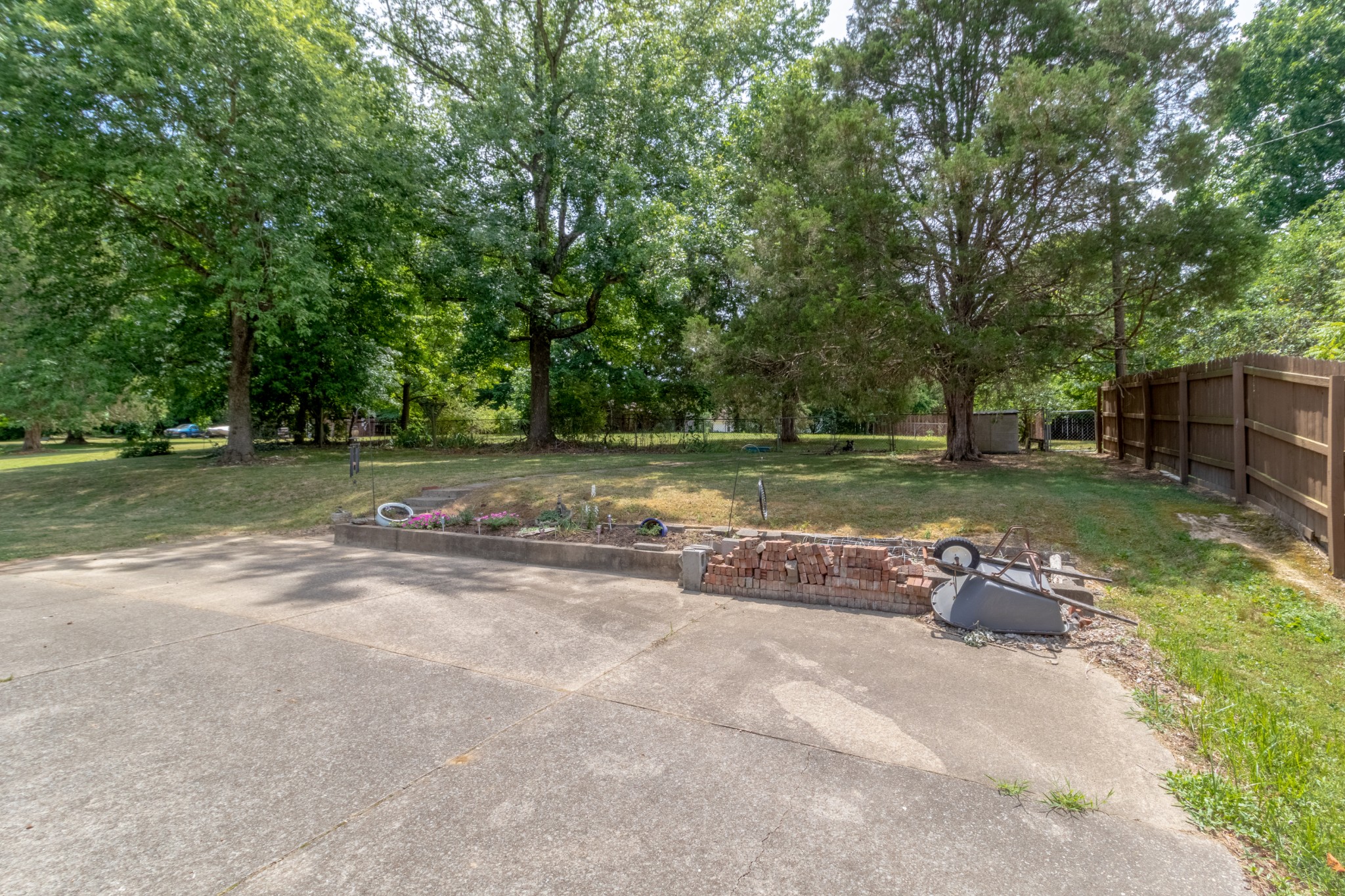 571 Bryan Road Clarksville, TN 37043 - Photo 4 of 7 a backyard of a house with barbeque oven table and chairs