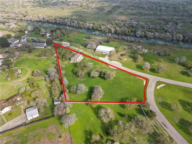 an aerial view of a house with swimming pool
