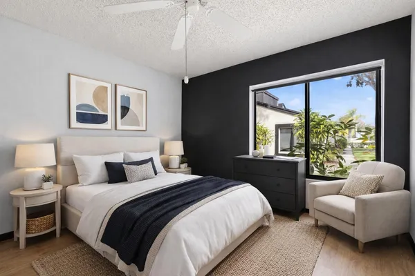 a bedroom with a large bed and a couch