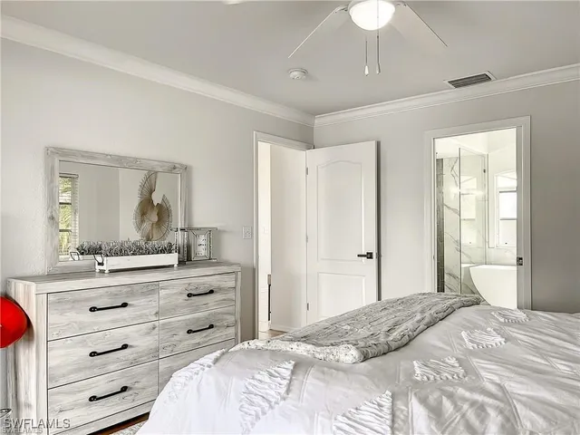a bedroom with a bed and a dresser