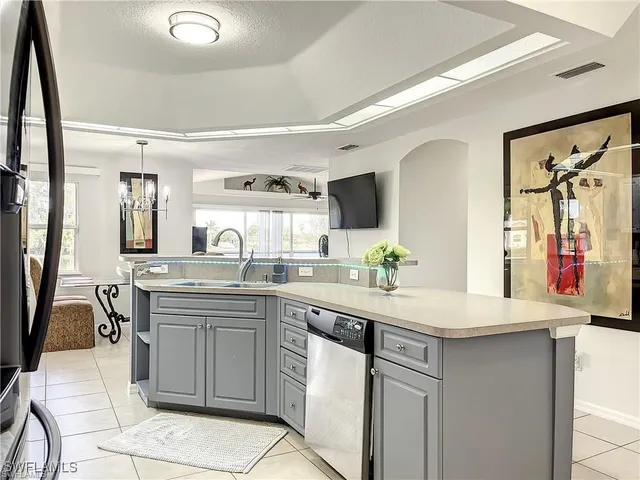 a kitchen with a sink counter top space and cabinets