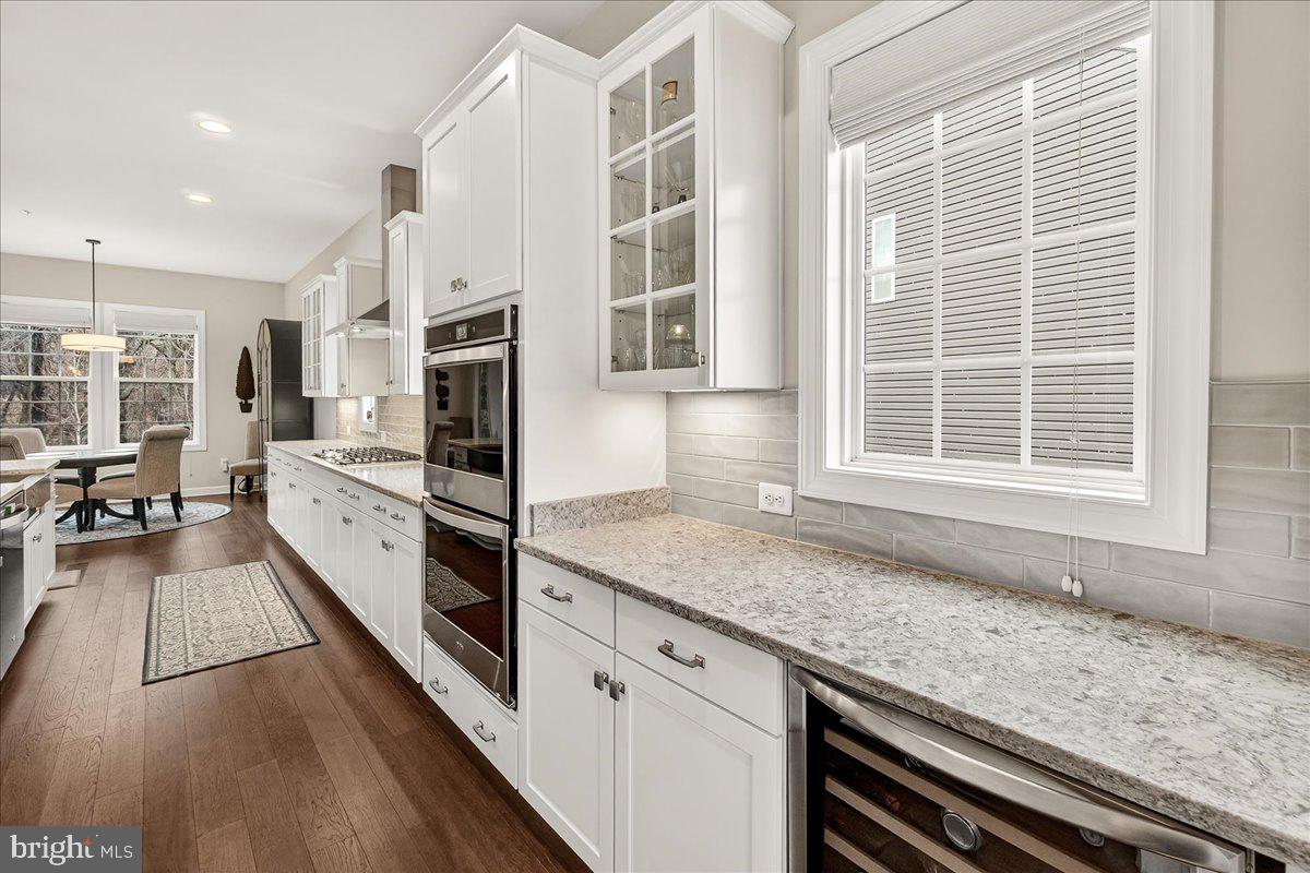 5487 Tallyn Ridge Drive Frederick, MD 21704 - Photo 12 of 80 a kitchen with stainless steel appliances granite countertop a stove a sink and a granite counter tops