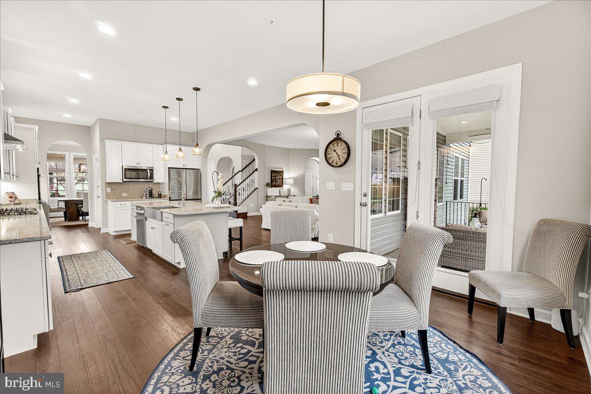 5487 Tallyn Ridge Drive Frederick, MD 21704 - Photo 19 of 80 a large kitchen with a table and chairs