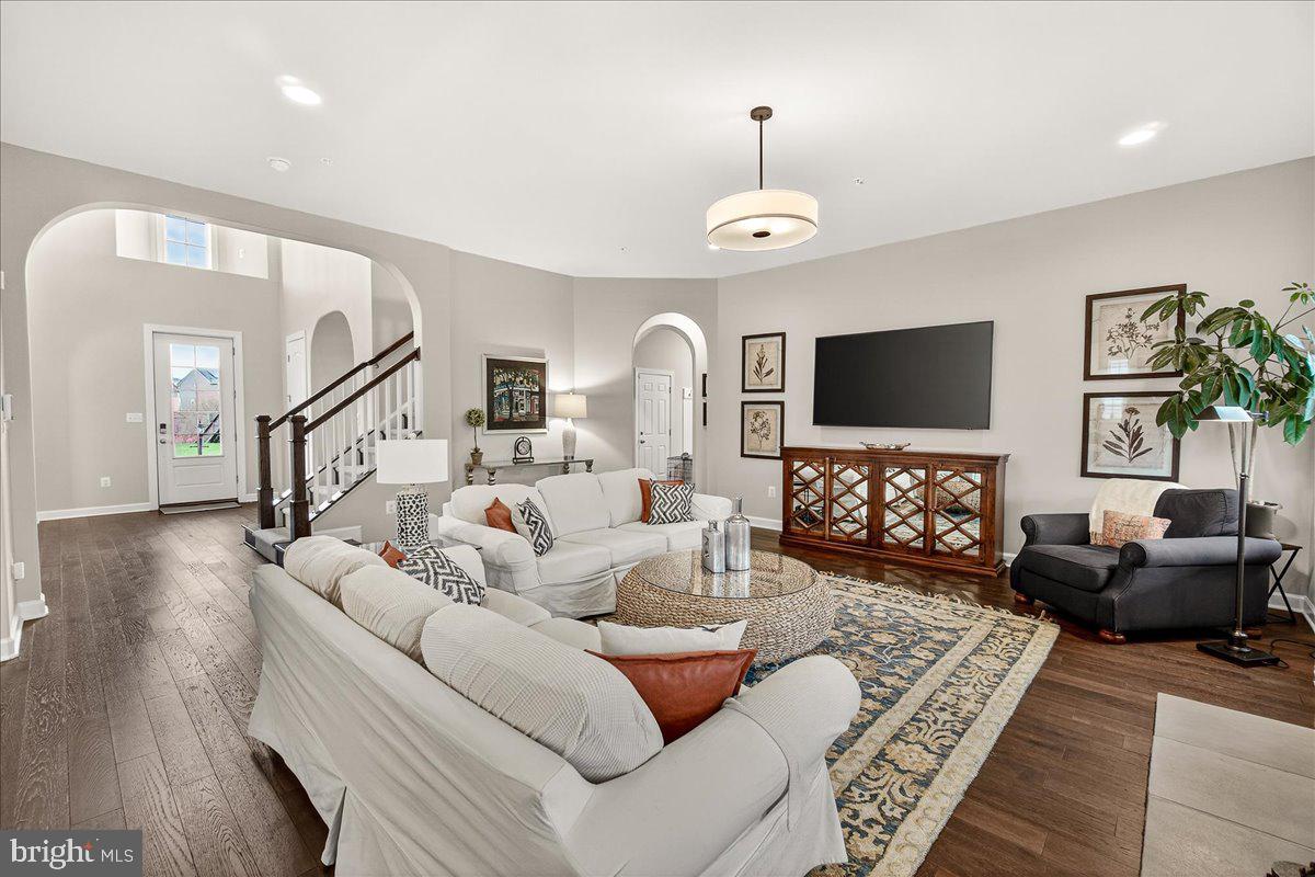 5487 Tallyn Ridge Drive Frederick, MD 21704 - Photo 23 of 80 a living room with furniture and a flat screen tv