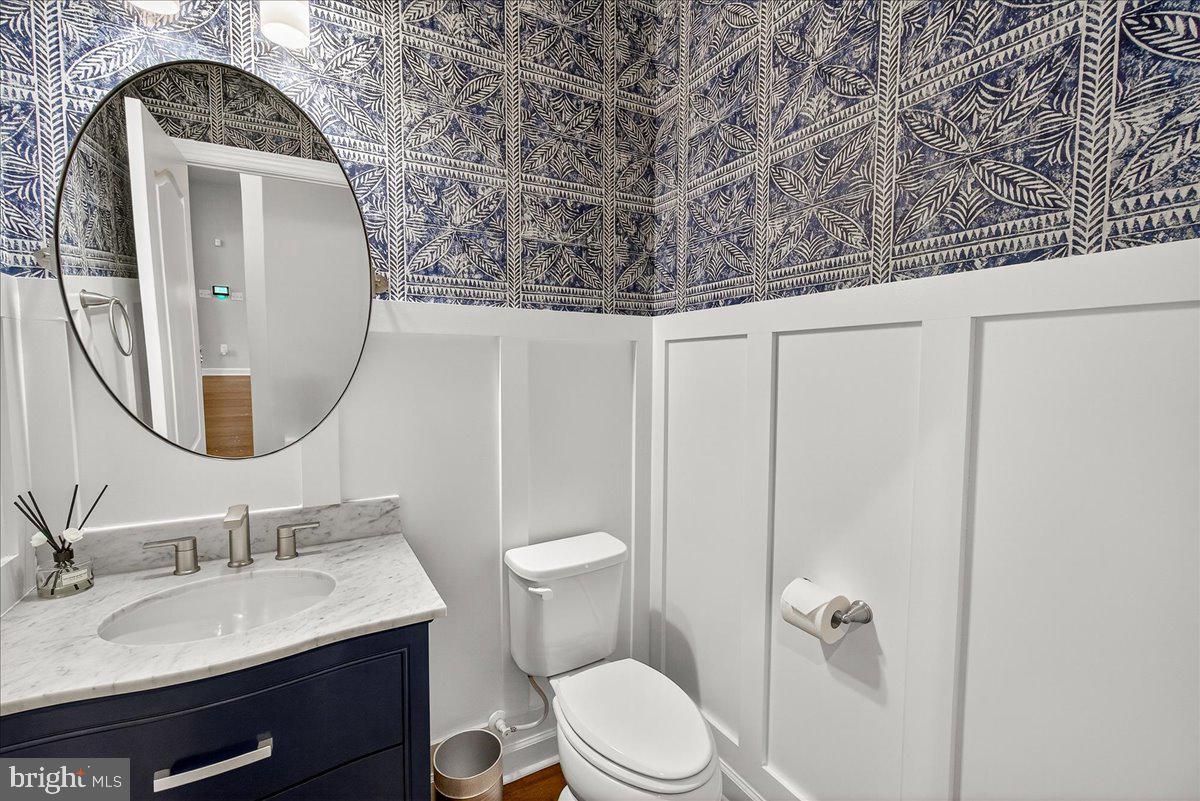5487 Tallyn Ridge Drive Frederick, MD 21704 - Photo 25 of 80 a bathroom with a granite countertop sink mirror vanity and toilet