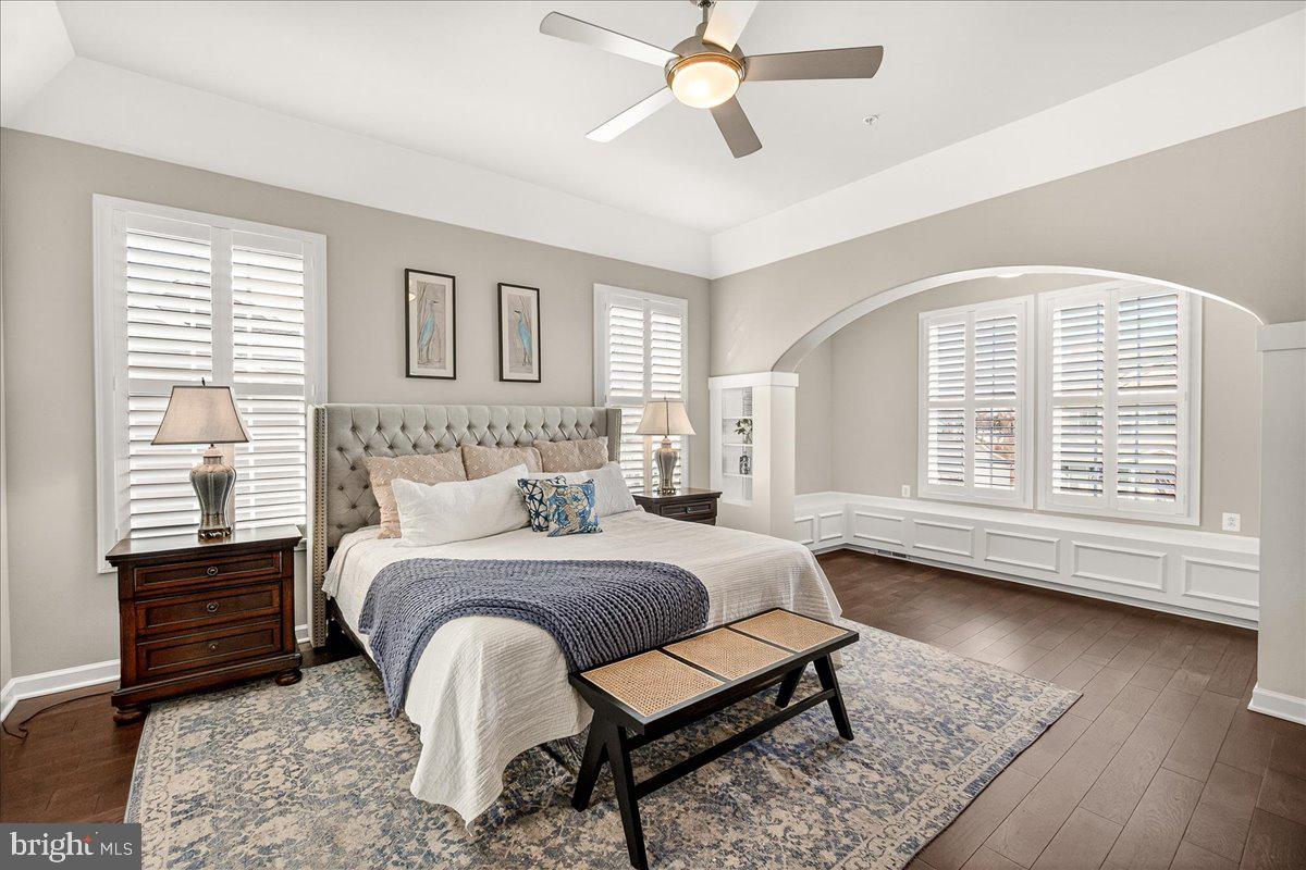 5487 Tallyn Ridge Drive Frederick, MD 21704 - Photo 27 of 80 a bedroom with a bed a dresser and wooden floor