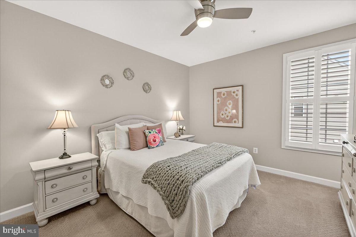 5487 Tallyn Ridge Drive Frederick, MD 21704 - Photo 34 of 80 a bedroom with a bed and a night stand